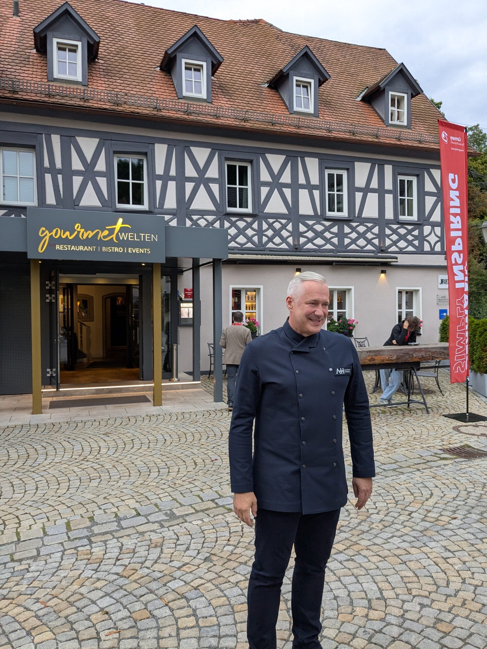 Alexander Hermann TV celebrity chef outside of his own restaurant in Wirsberg not far from Bayreuth